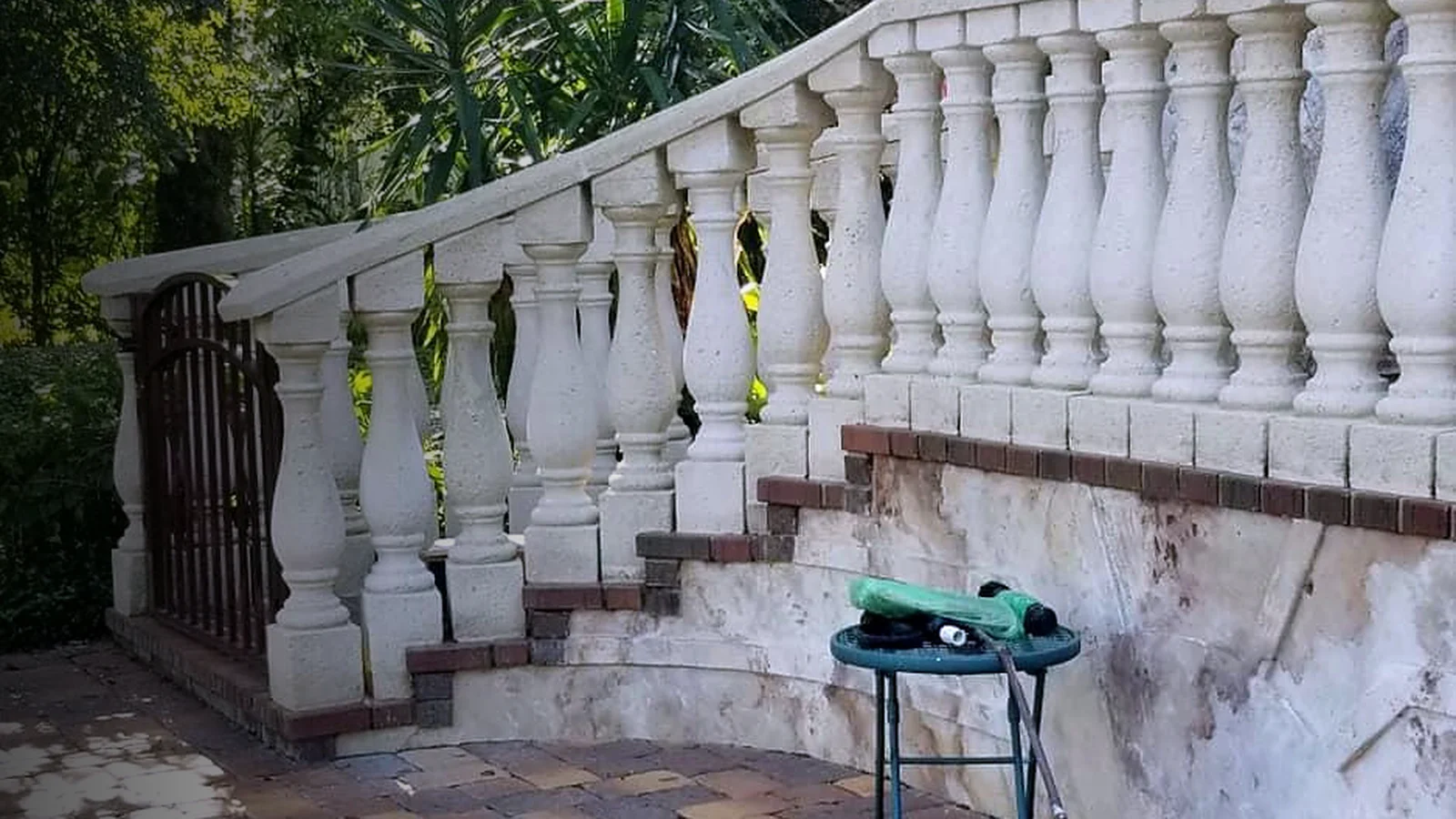 Patio masonry and railing after exterior cleaning.