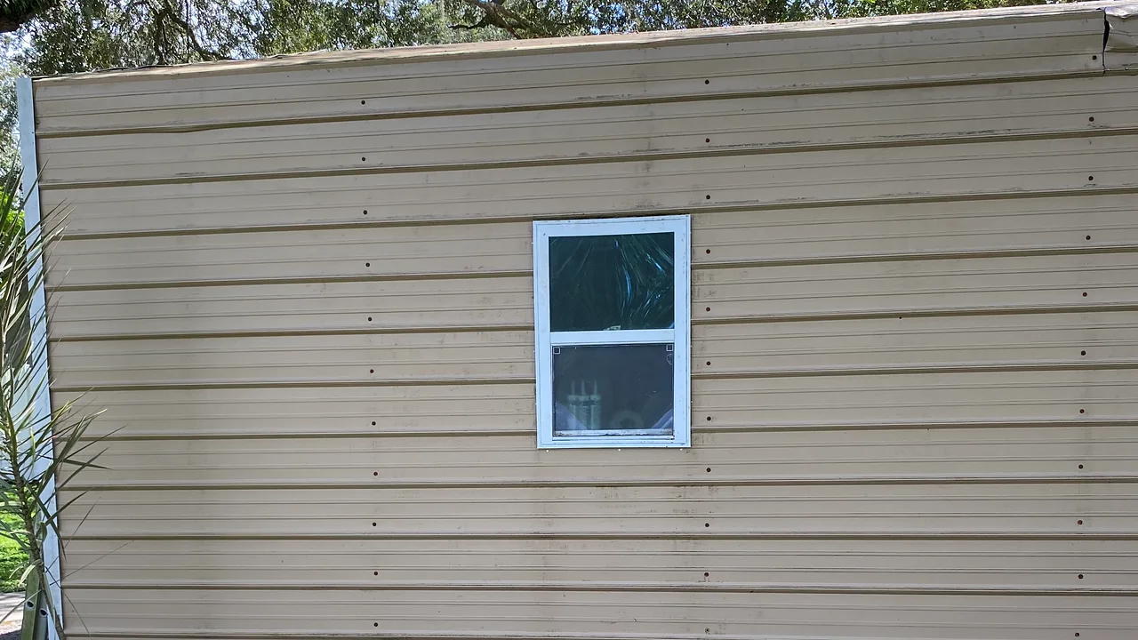 House exterior reference for visible gutter exterior washing.